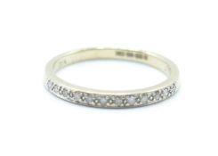 A hallmarked 9ct gold band ring being set with diamond chips. Hallmarked Sheffield. Weight 1.6g.