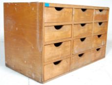 A vintage mid 20th Century haberdashery - shop dispaly  cabinet - chest of drawers. The chest having