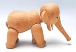 A 1960’s Danish teak wood articulated elephant by Kay Bojesen, with an articulated trunk, black