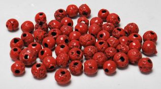 A good quantity of 20th century large red coral necklace beads each with drilled centres.