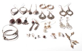 A collection of mixed vintage and 21st Century silver earrings to include a pair of twist design
