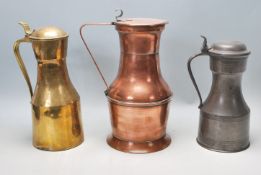 A good collection of three late 19th Century / early 20th century jugs to include a pewter example