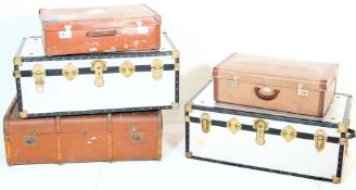 A collection of 5 early 20th Century streamer trunks and suitcases to include 2 vintage leather