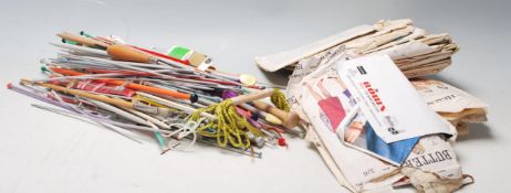 A collection of vintage 20th century sewing patterns of varying designs complete in the packaging