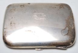 A silver hallmarked cigarette case of square form having rounded corners with engraved initials to