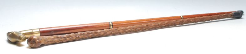 A pair of mid 20th century vintage walking sticks.