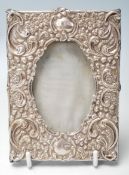 AN early 20th century silver hallmarked photo frame with foliate swags decorations. Hallmarks for