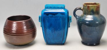 A Sarreguemines Majolica vase with twin handles, floral motifs to the central and geometric border