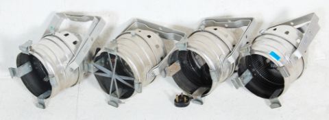 A set of 4 retro 20th century industrial polished metal stage lights for cinema - theatre being of
