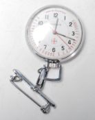 A vintage 20th Century Moeris nurses watch having a white enamelled face with arabic numerals to the