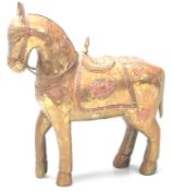 An antique early 20th Century brass and copper Chinese Imperial horse having the saddle and bridle