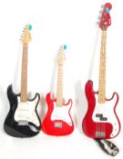 A collection of 3 vintage electric guitars to include an Encore black Stratocaster style guitar
