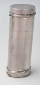 A silver hallmarked engine turned case in a cylindrical form with double ends hinged lids. London