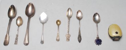 A good mixed group of silver spoons dating from the early 20th Century to include a golfing