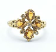 A 20th Century hallmarked 18ct gold Renaissance style ring being set with four oval cut yellow