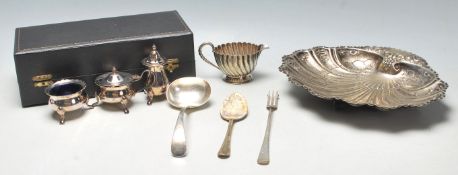 A collection of silver plated wares to include a set of silver plated cruets to include a matching