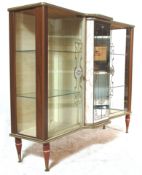 A 1930's Art Deco melamine breakfront china display cabinet / vitrine. Raised on tapering legs
