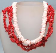 A 20th Century coral necklace having three strands of threaded coral together with a light pink