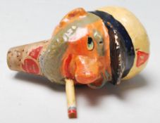 A vintage retro novelty oil pourer / bottle stopper in the form of a smoking sailor having hand