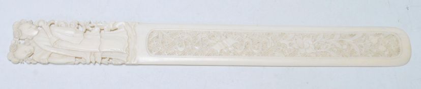 An early 20th Century Chinese ivory letter opener with a carved and pierced handle decoration