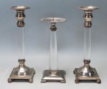 A collection of 20th century silver plated and Perspex candlesticks having square bases, Perspex