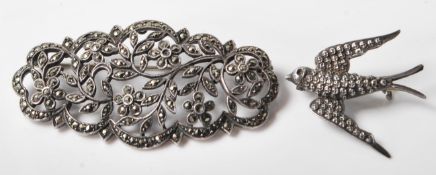 A silver hallmarked marcasite bar brooch with floral decoration and makers mark to the back for