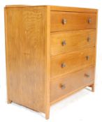 A 20th Century, circa 1940's oak chest of drawers having four double drawers with cast metal knob