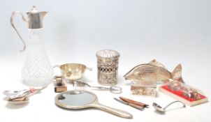 A collection of 20th Century silver plated and related items to include an unusual menu holder in