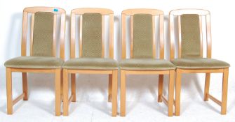 A set of four vintage retro 20th Century beech wood dining chairs having velour upholstered back and