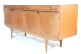 A retro vintage 20th Century Danish inspired teak sideboard / credenza by Times Furniture. Having