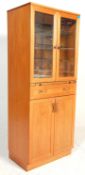 A vintage retro 20th Century G-Plan teak upright mirror backed double door cocktail cabinet