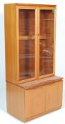 A vintage mid century Danish influenced teak wood highboard - display cabinet unit. The breakfront