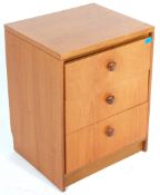 A retro vintage mid 20th Century teak pedestal chest of drawers. The upright body with round drawers