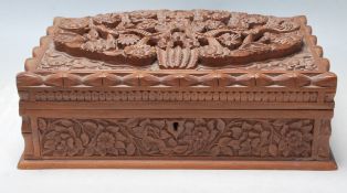 A vintage 20th Century finely carved fruitwood jewellery box having bird and floral decoration