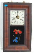 A late 19th century American mahogany wall clock of rectangular form having a square face to the top