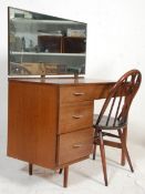 A retro vintage mid century teak wood dressing table desk with open kneehol recess flanked by a
