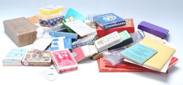 A good collection of playing cards to include New Bond, War Auxiliary Policeman,Bridge Swiss Playing