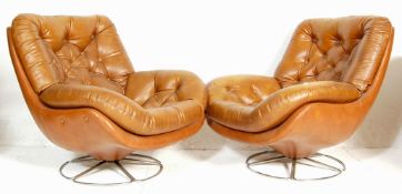 A pair of vintage, mid century retro Danish inspired egg chairs  - easy swivel armchairs. Each being