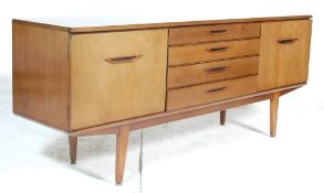 A vintage retro 1970's Jentique teak wood sideboard credenza having a central bank of four drawers