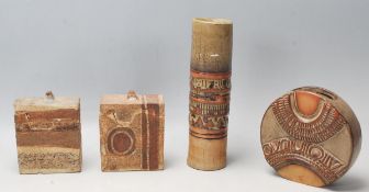 A collection of retro vintage 20th century stoneware studio pottery vases and pots lidded items in a