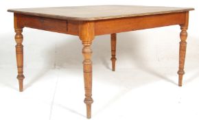 A 19th Century Victorian oak dining table of rectangular form having a stripped back tabletop over a
