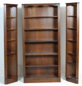 A large Jaycee / Old Charm  Jacobean revival oak triple bookcase cabinet having a central bookcase