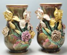 A pair of late 19th century Victorian large Majolica baluster vases, having applied floral details