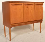 A retro mid 20th Century G-Plan teak wood raised upright pedestal sideboard credenza having three