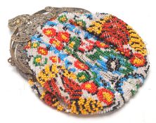 A vintage early 20th Century beaded ladies purse having a coloured bead floral design with a