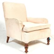 A stunning early 20th century  easy armchair in the manner of Howard & Sons. The chair having
