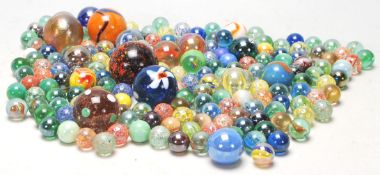 A collection of 20th Century glass marbles to include a wide selection of colours and styles to