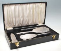 A vintage hallmarked sterling silver vanity set comprising of a silver mirror, silver hair brush,