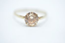 A hallmarked 9ct gold ring having a central white stone within a cathedral setting and pierced