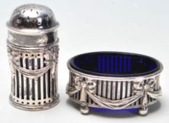 A pair of silver hallmarked table cruets to includ